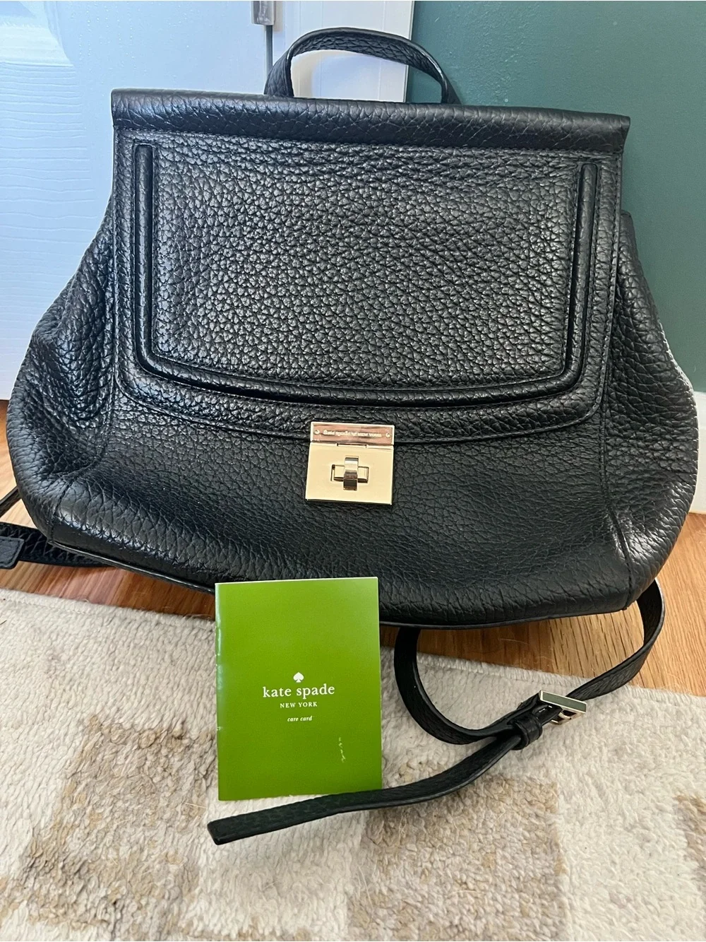 kate spade Black Pebbled Leather Backpack with Gold-Tone Turn Lock